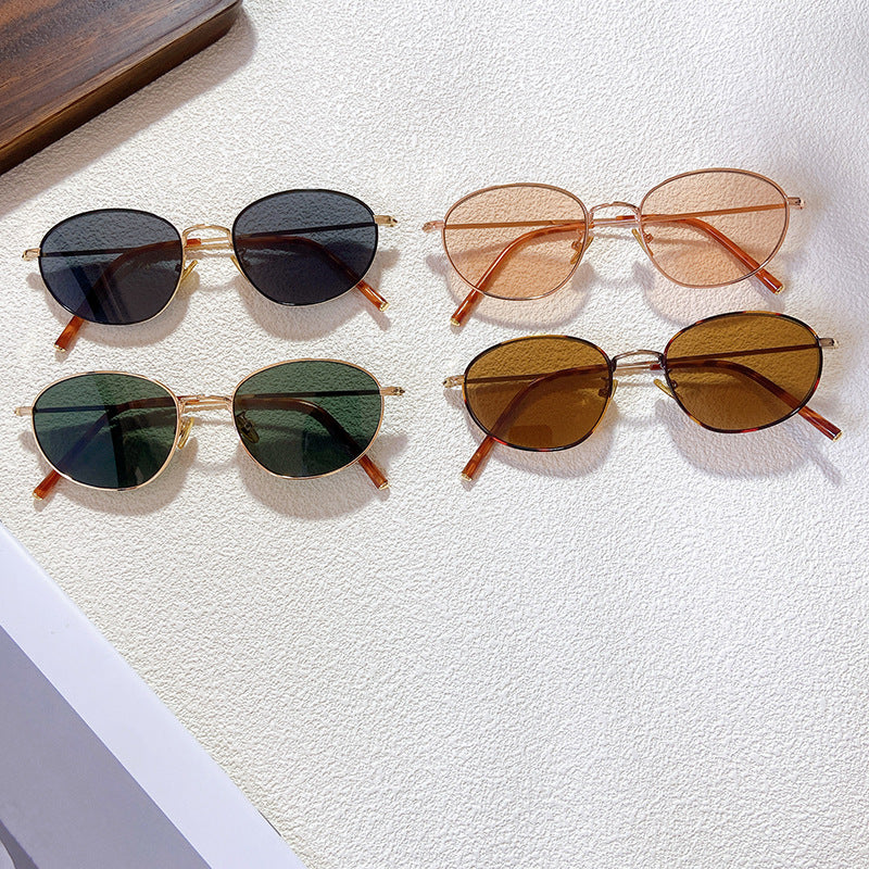 Elegant oval glasses for women, providing essential UV protection with a stylish, modern frame design.