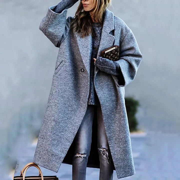 A chic women's oversized coat. Comfortable fashion statement & versatile outerwear.