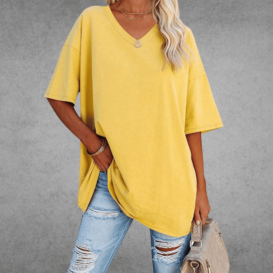 Chic oversized V-neck shirt for women, a comfortable loose-fit top for versatile casual everyday style.