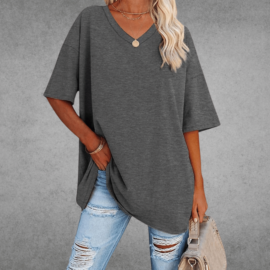 Stylish women's V-neck oversized shirt, perfect for a relaxed fit, spring fashion, and summer comfort.