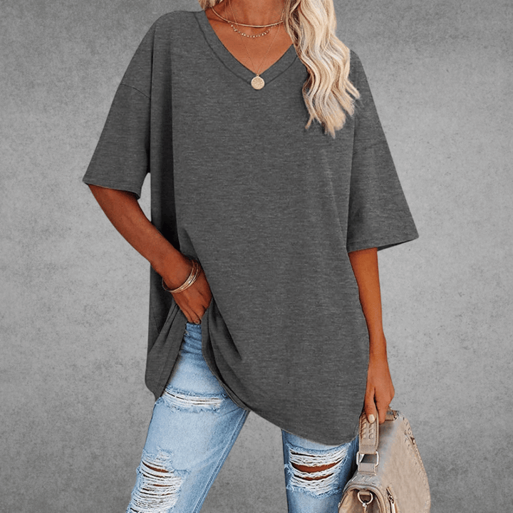 Stylish women's V-neck oversized shirt, perfect for a relaxed fit, spring fashion, and summer comfort.