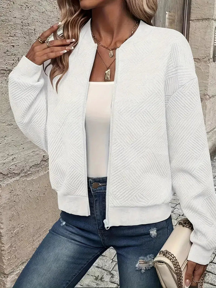 Elegant women's patterned front zip cardigan. A versatile layering piece for casual wear.