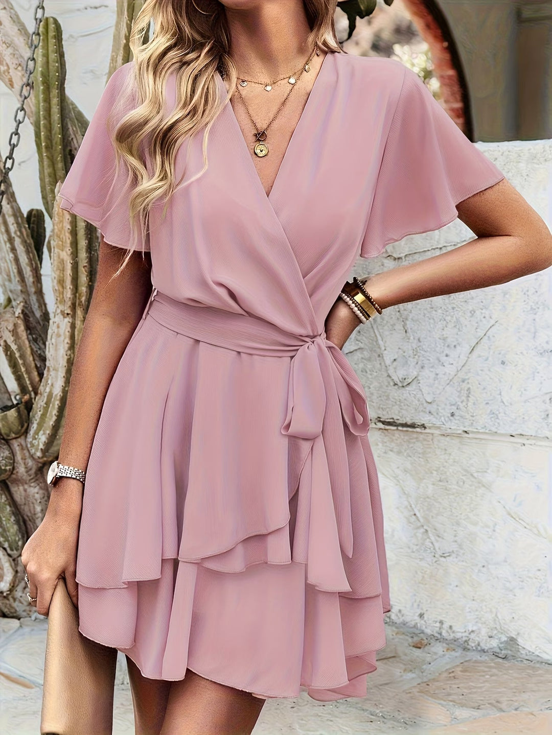 Elegant and casual women's flowy short sleeve dress in pink, perfect for spring fashion or comfortable summer days.