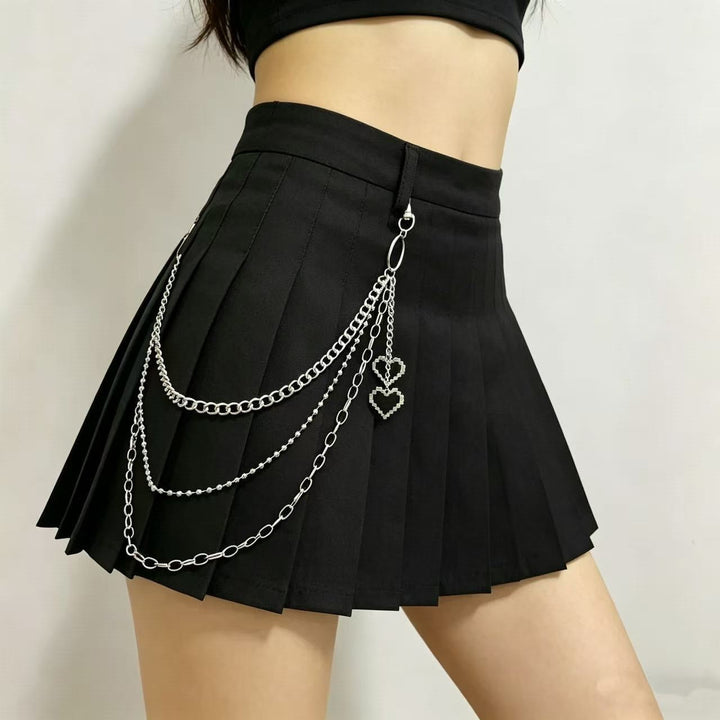 Trendy women's pleated skirt with striking decorative chains. A fashionable choice for a unique style statement.