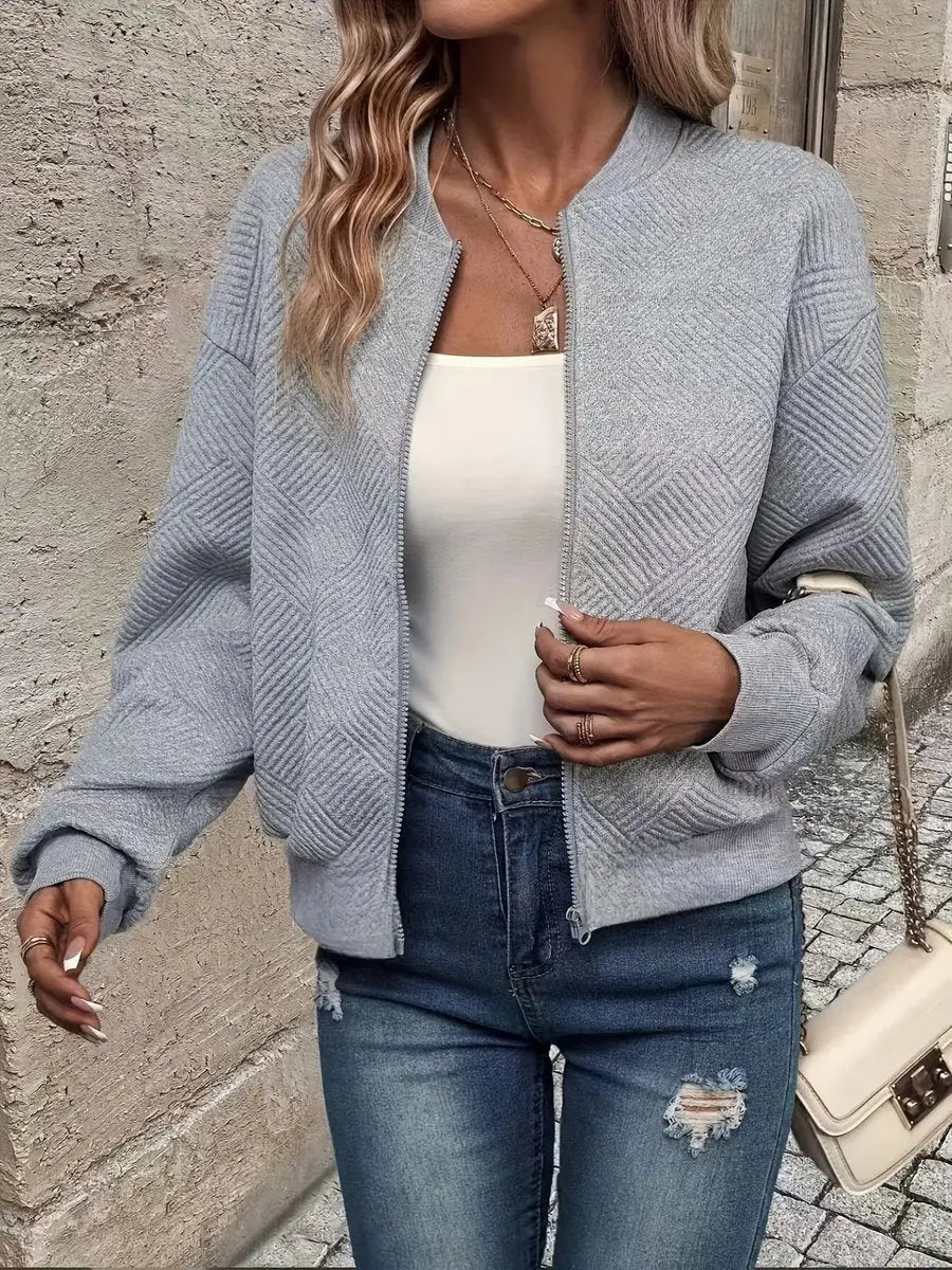 Women's stylish quilted bomber jacket. Cropped zip-up design, ideal for spring & everyday wear.