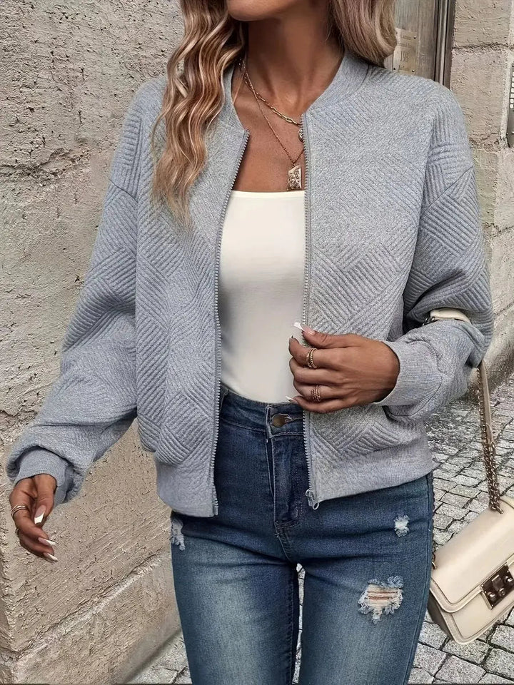 Women's stylish quilted bomber jacket. Cropped zip-up design, ideal for spring & everyday wear.