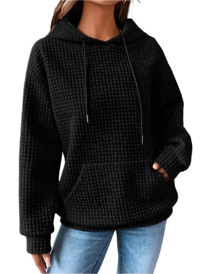Women's stylish quilted hoodie. Cozy, chic long-sleeve pullover, perfect for comfortable everyday wear.