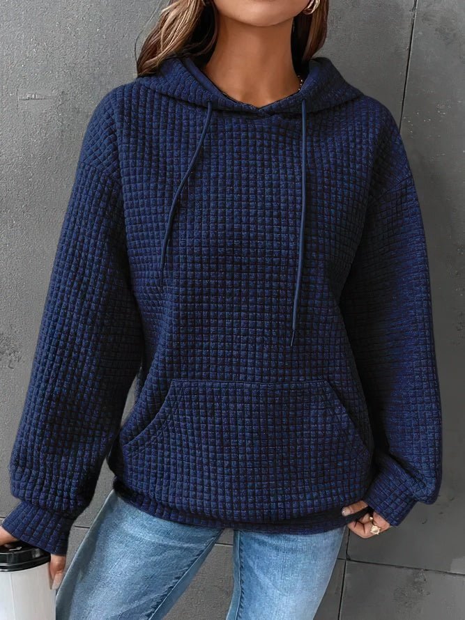 Cozy women's quilted hoodie. Chic and comfortable long-sleeve pullover, ideal for casual everyday fashion.