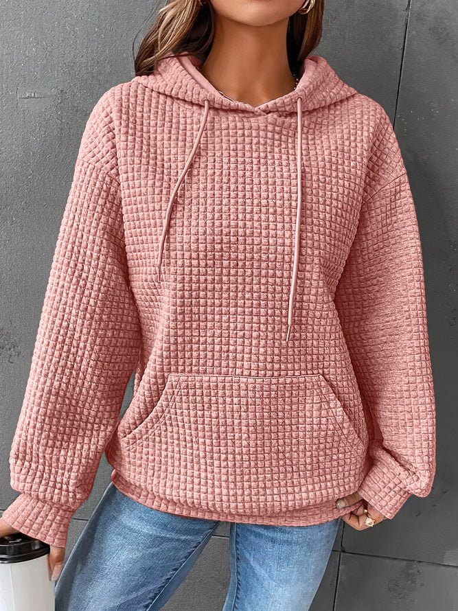 Chic women's quilted hoodie. Comfortable long-sleeve pullover design, perfect for cozy everyday fashion.