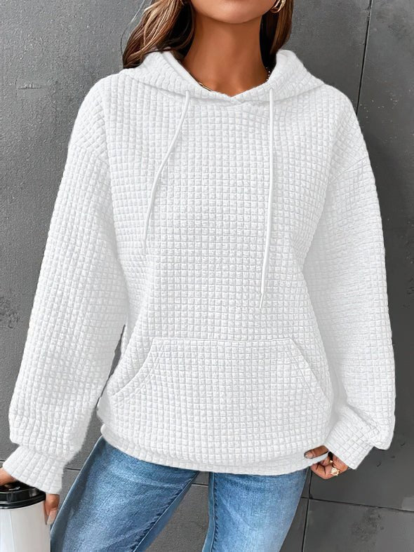 Trendy women's quilted hoodie. Soft, long-sleeve pullover for stylish and cozy casual everyday wear.
