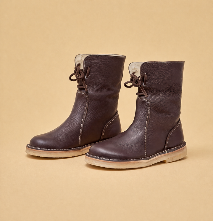 Protect your feet with warm women's short winter boots. Stylish, cozy & comfortable flat heel snow footwear for outdoors.