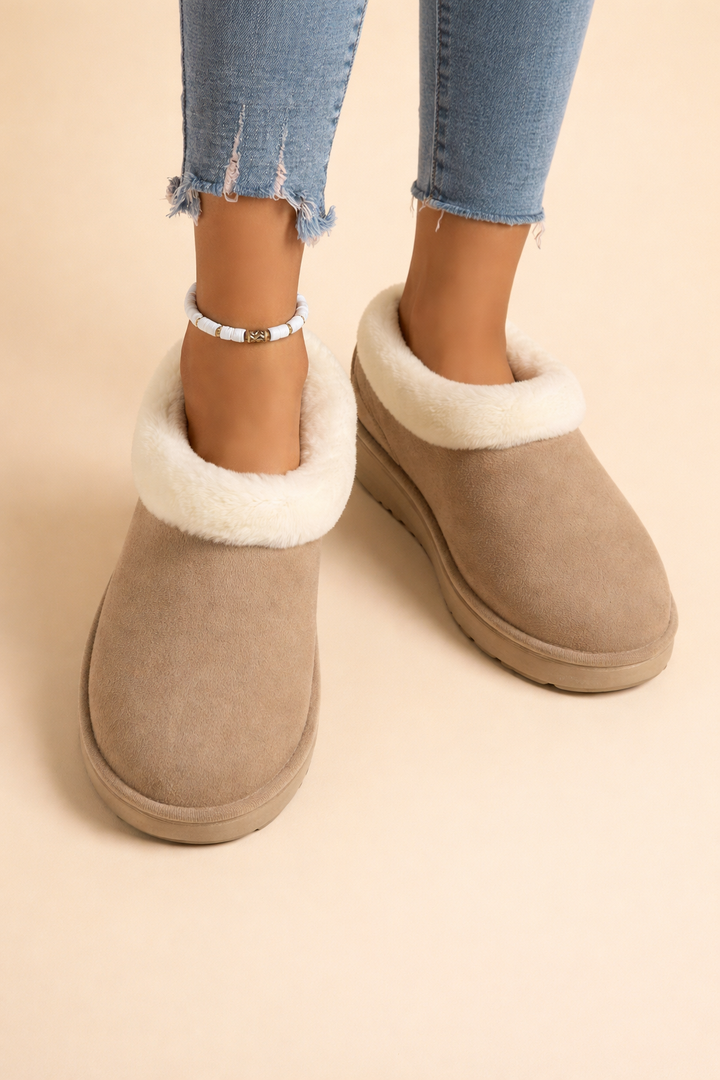 Chic women's slip-on winter boots, offering exceptional warmth & style for snowy, cold weather outings.