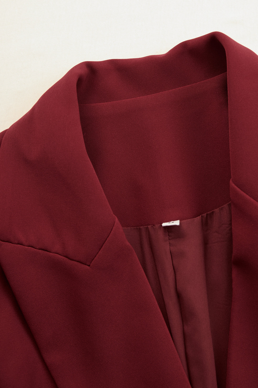 Stylish tailored midi dress for women, a V-neck blazer style for sophisticated occasions.