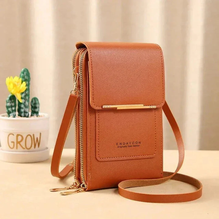 Sleek black women's touch screen crossbody bag. Perfect phone purse for shopping, travel, or daily errands.