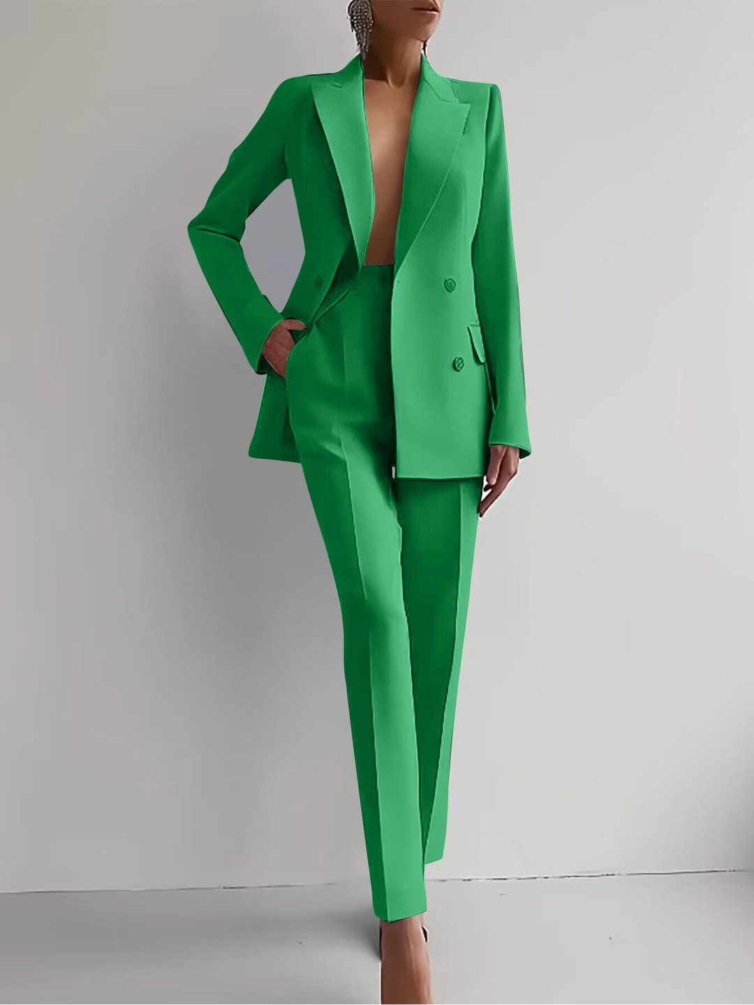 Comfortable women's two-piece suit with casual trousers & stylish matching top for effortless everyday wear.