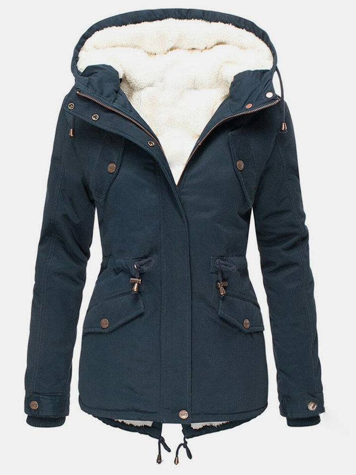 Stylish women's water-resistant winter coat with zipper, designed for warmth and comfort in cold conditions.