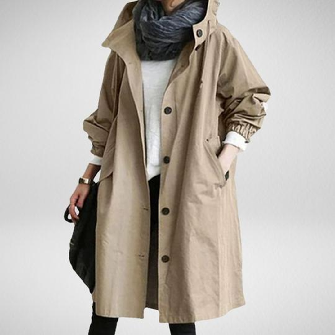 Women's stylish waterproof long raincoat, perfect for rainy days. Features weather protection & modern design.