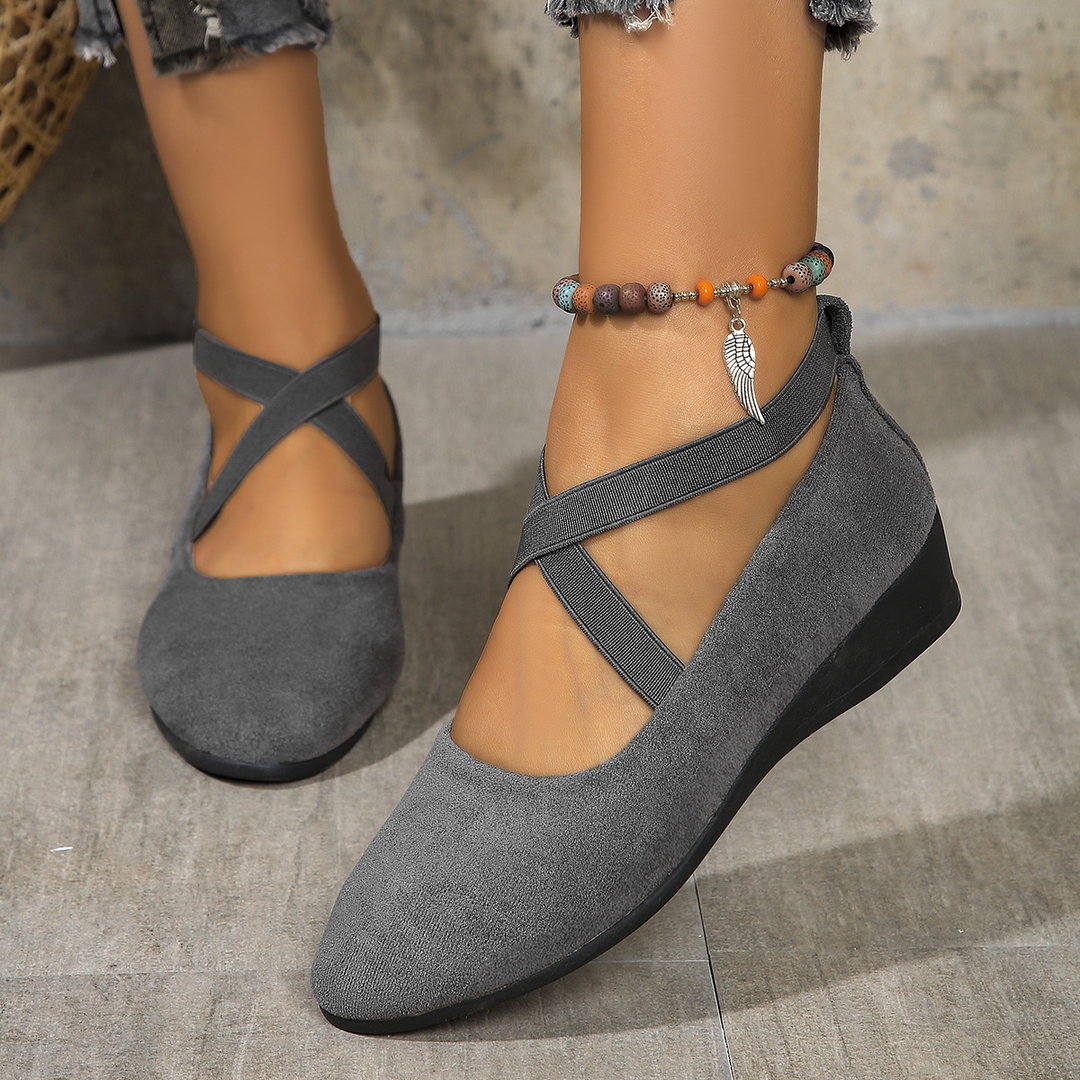Women's comfortable wedge heels with elastic band, offering style and support for all-day wear. Versatile design.