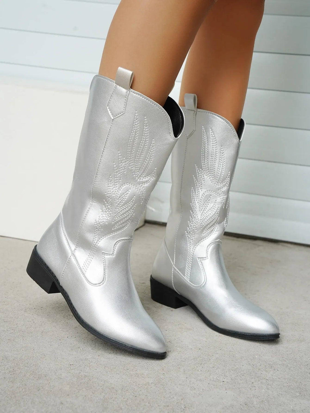 Fashion-forward women's boots, Western cowboy inspiration, chic and elegant footwear.