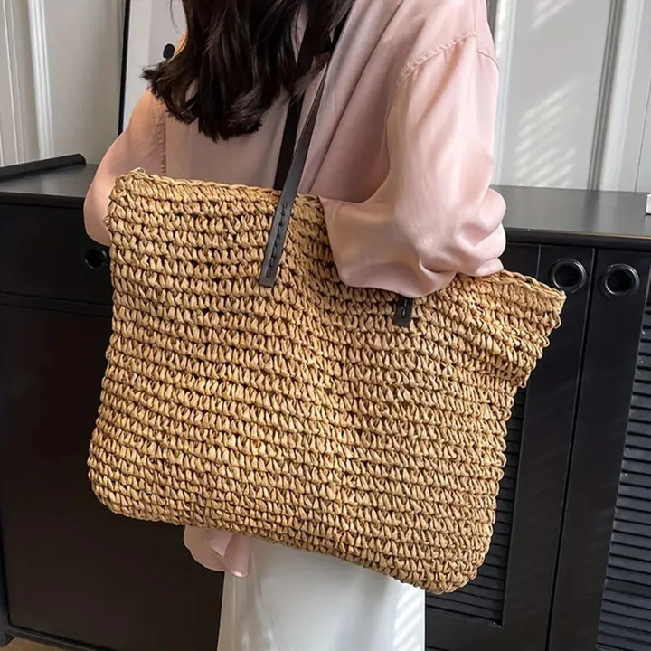 Women's stylish woven tote bag in neutral colors, perfect for daily carry & fashion accessory.
