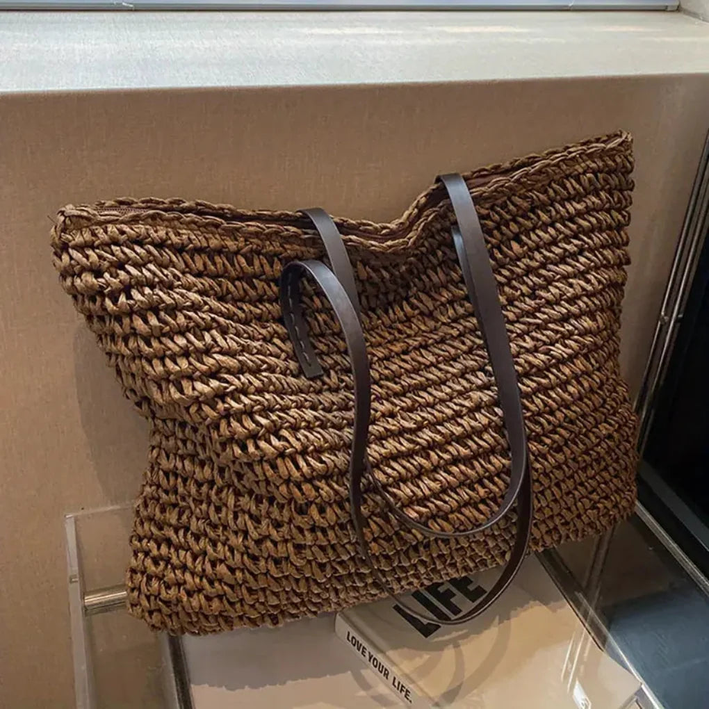 Stylish woven tote bag for women. Versatile daily carry handbag, a chic fashion accessory.