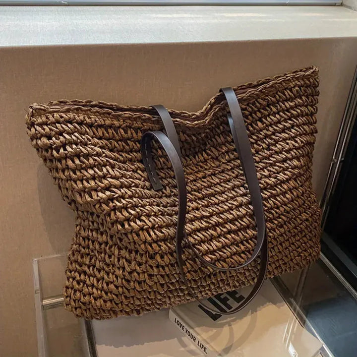 Stylish woven tote bag for women. Versatile daily carry handbag, a chic fashion accessory.
