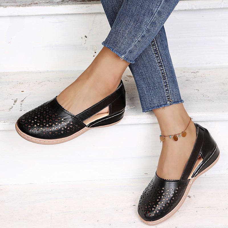 Close-up of women's comfortable espadrille sandals, showing woven sole & soft upper. Perfect summer slip-ons.