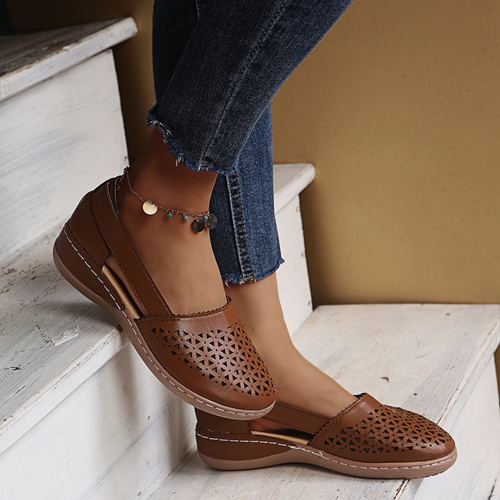Woman walking in comfortable women's espadrille sandals, showcasing casual and elegant summer footwear.