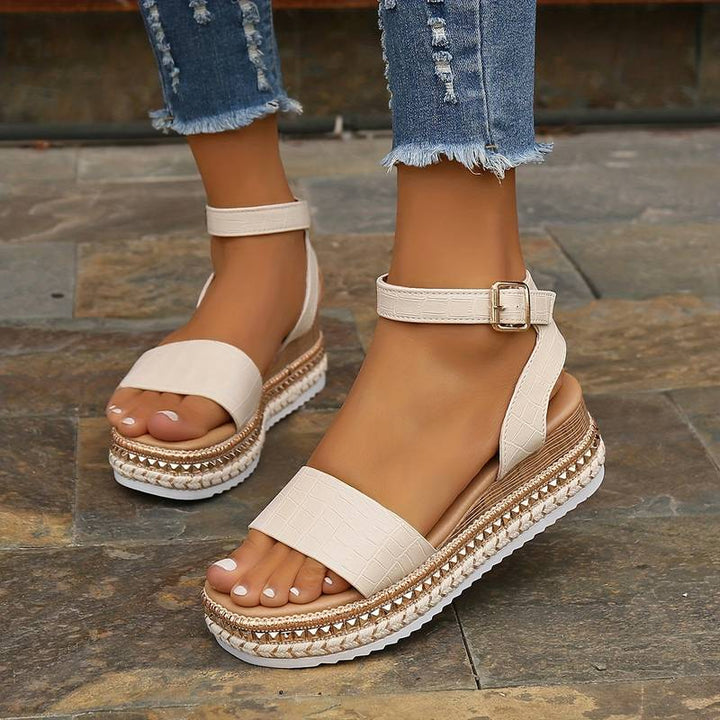Women's summer platform sandals with open toe and adjustable ankle strap, perfect for casual beach footwear.