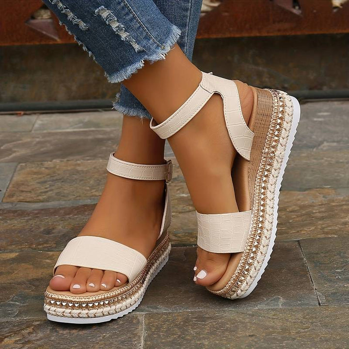 Women's casual platform sandals, designed with an open toe and comfortable ankle strap, great for summer fashion.