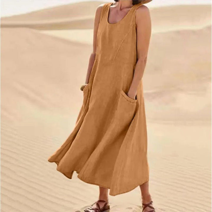 Flowy sleeveless U-neck maxi dress with pockets, women's boho style, ideal for summer casual outings.