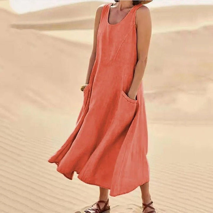 Stylish women's U-neck maxi dress, sleeveless with pockets, perfect for summer boho fashion & relaxed events.
