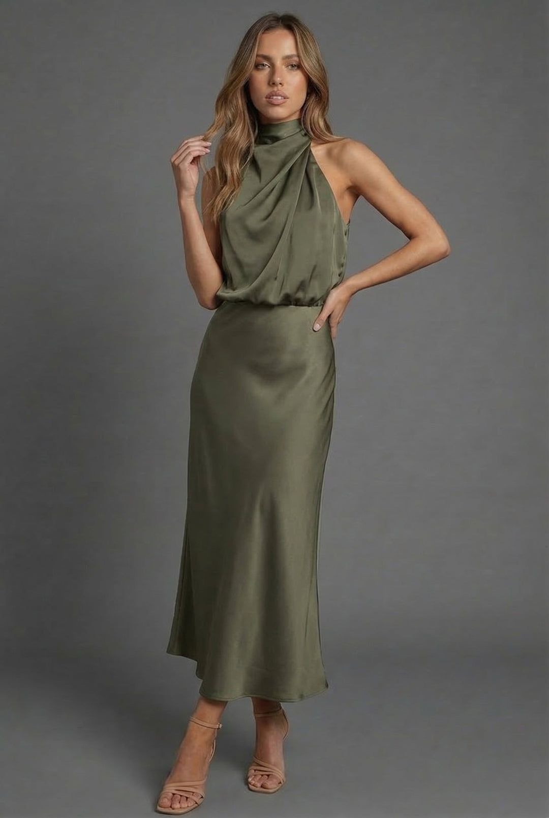 Sophisticated women's halter neck midi dress for summer formal occasions or wedding guests.