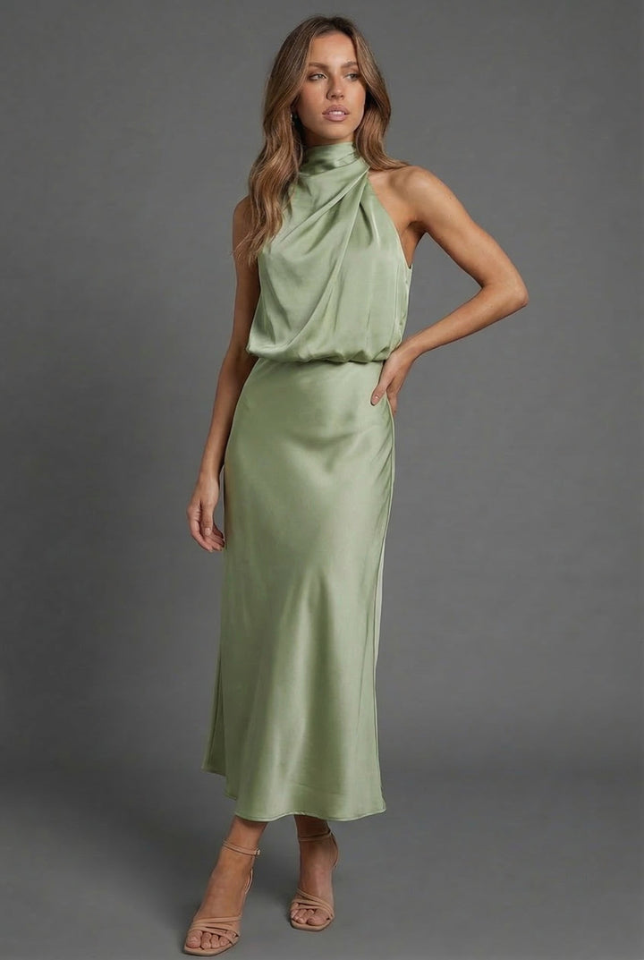 Beautiful women's summer wedding guest halter neck midi dress. Elegant formal occasion wear.