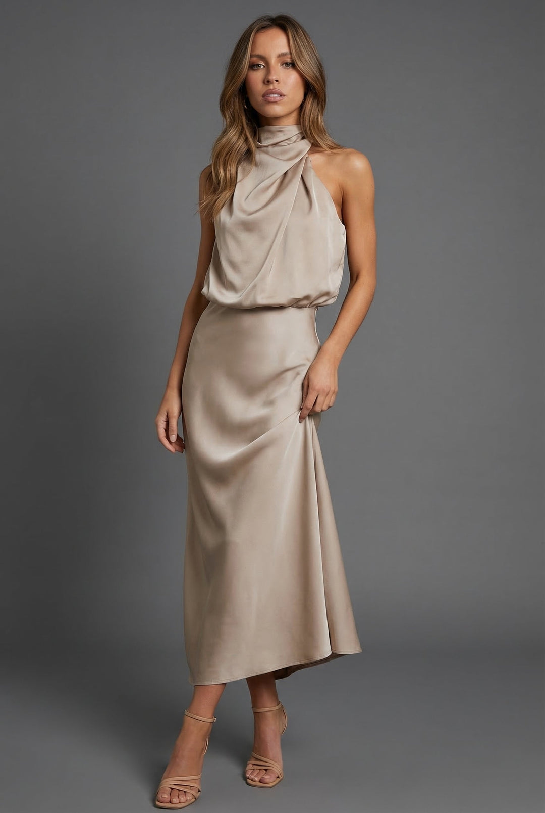Elegant women's halter neck midi dress with open back, perfect for summer wedding guests.
