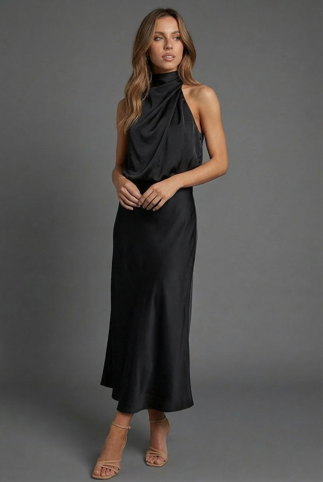 Formal women's halter neck midi dress for summer weddings and elegant events. Open back detail.