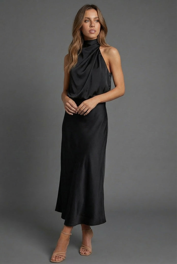 Formal women's halter neck midi dress for summer weddings and elegant events. Open back detail.