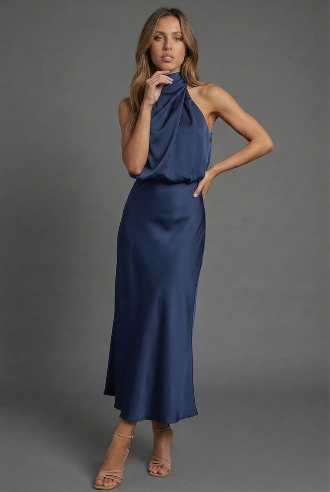 Perfect summer midi dress for women, featuring a halter neck and open back. Ideal for wedding guests.