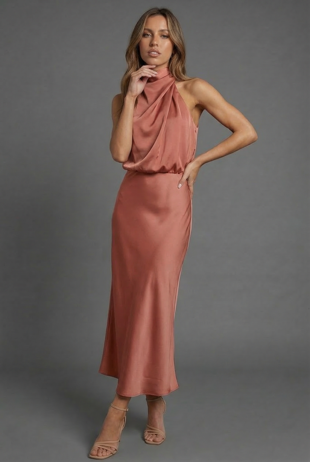 Elegant women's midi dress with halter neck, open back. Versatile for summer weddings & parties.