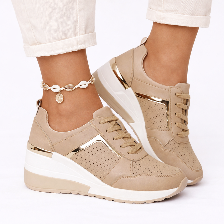 Stylish ladies wedge trainers for athleisure and everyday comfort, featuring a supportive fit.