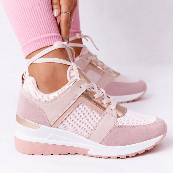 Lace-up women's wedge trainers, designed for travel and casual style, with a comfortable supportive fit.