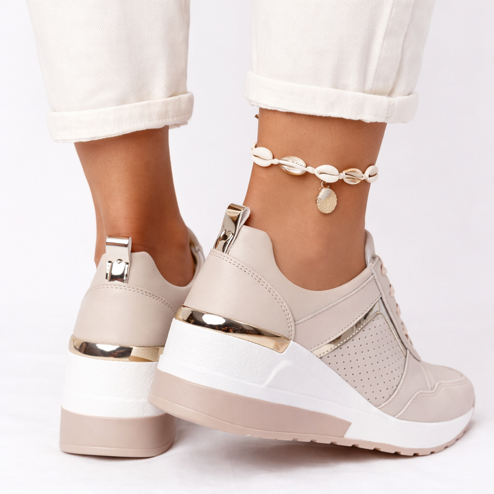Breathable women's everyday wedge trainers, offering a supportive fit for all-day comfort and style.