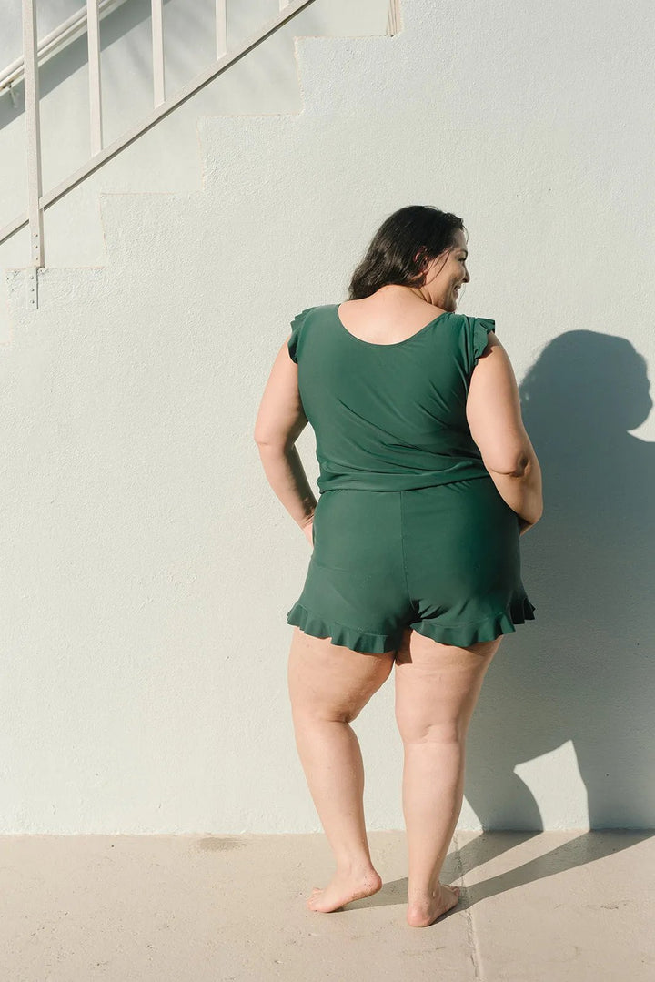 Women's flattering one-piece swimsuit, offers full support with its built-in bra for beach outings.
