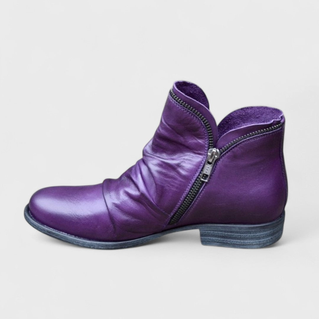 Women's supportive orthopedic ankle boots, comfortable for all-day wear. Elegant design, various colors.