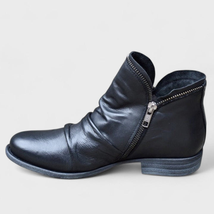 Black women's orthopedic ankle boots, providing supportive comfort and elegant style for daily wear.