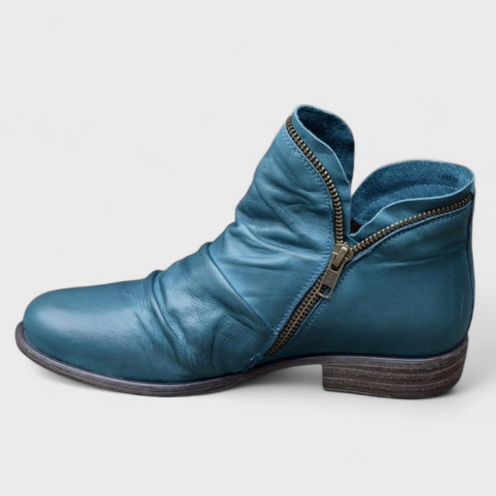Purple women's supportive ankle boots, orthopedic design for all-day comfort. Stylish and versatile footwear.