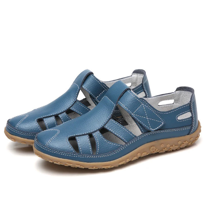 Side view: Women's orthopedic sandals, adjustable straps & comfort-focused sole.