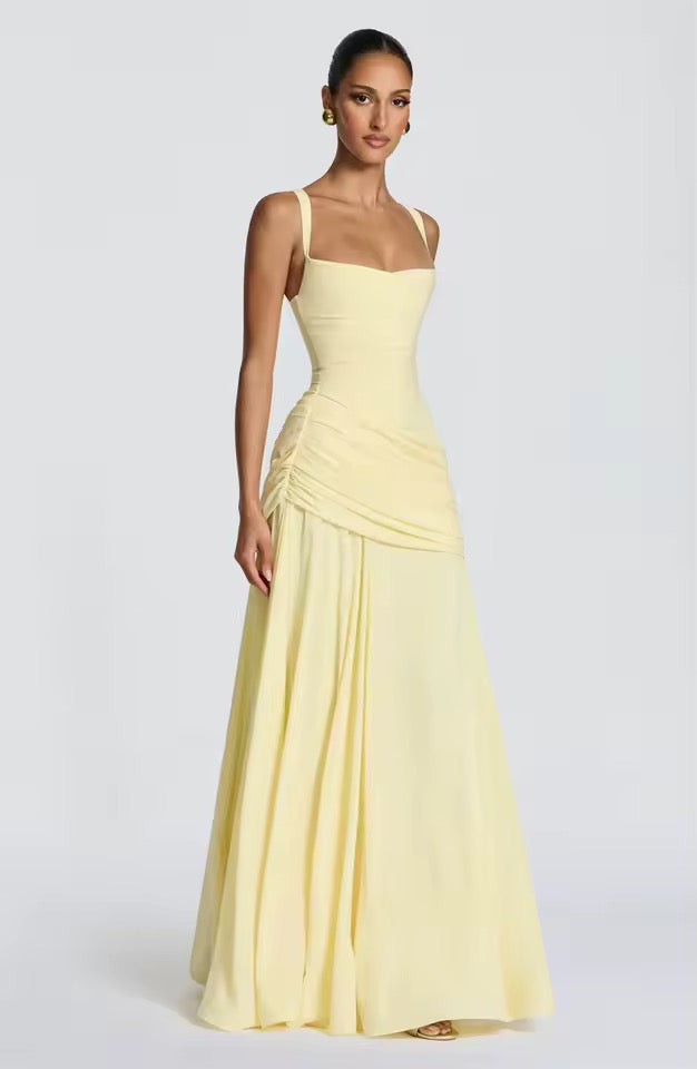 Flowy women's sleeveless maxi dress with a flattering sweetheart neckline, essential for summer beachwear.