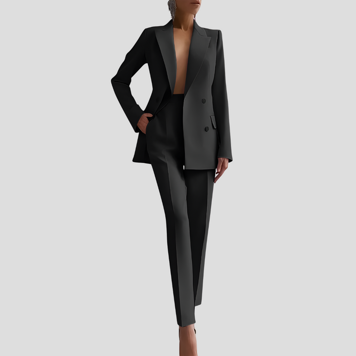 Model wearing a chic women's tailored blazer and trouser co-ord set, styled for a modern elegant look.