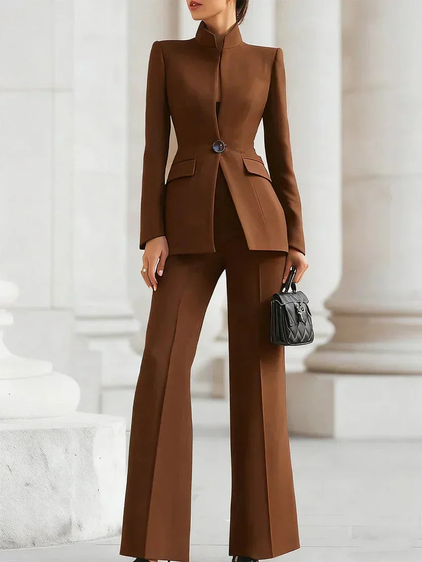 Tailored longline blazer and flattering flared trousers in a women's chic suit set. Business & office wear.
